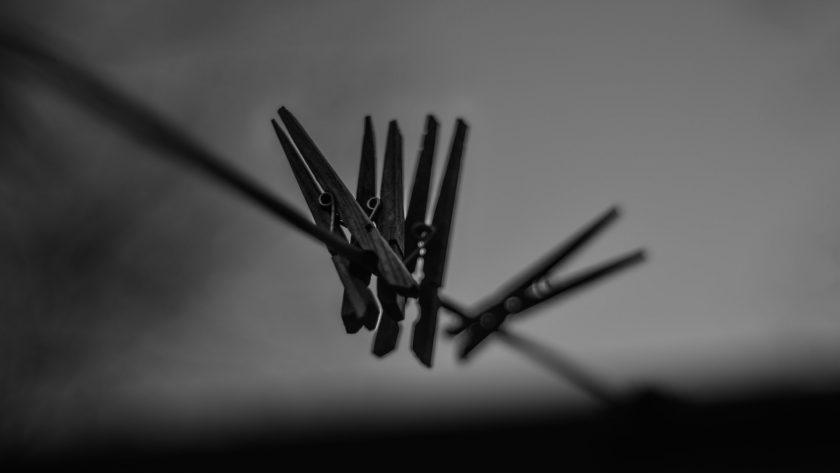 Clothespins on line in black and white