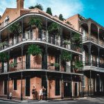 New Orleans historical architecture. Wrought iron balconies and ferns.